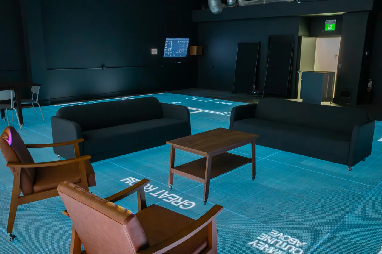 Sofas and armchairs arranged around a coffee table on the plan