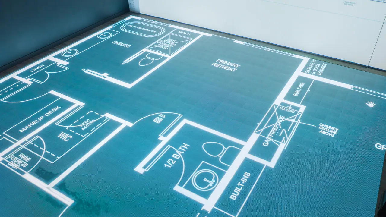 An overhead view of a bathroom and bedroom drawn at full scale
